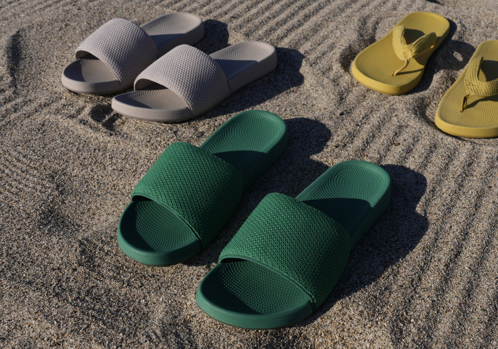 Slides in green, yellow and neutral colors on sand