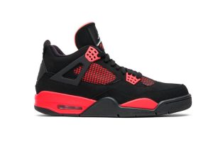 A front view of the outer side of the right shoe of the Jordan 4 Retro ‘Red Thunder,’ showcasing its overall black and red colorway and genuine leather material