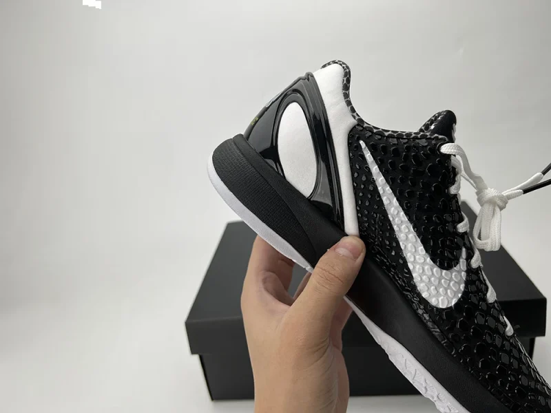 A detailed rear view of the Kobe 6 Protro ‘Mambacita Sweet Sixteen,’ showcasing the black-and-white heel and the TPU heel support design.