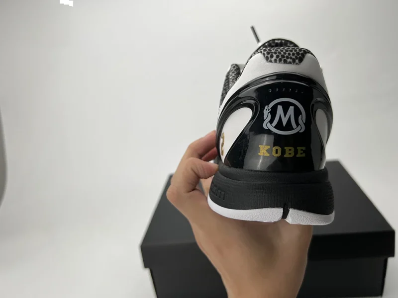 A rear view of the Kobe 6 Protro ‘Mambacita Sweet Sixteen,’ showcasing the signature dual-snake logo on the heel.