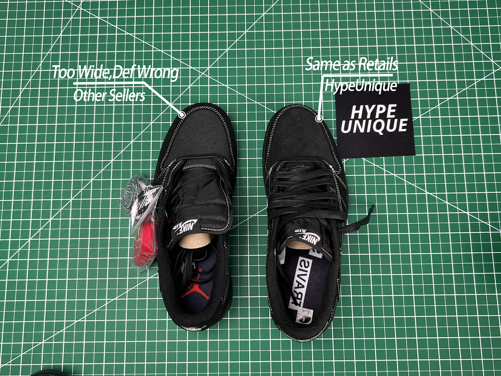 a pair of black shoes on a green surface