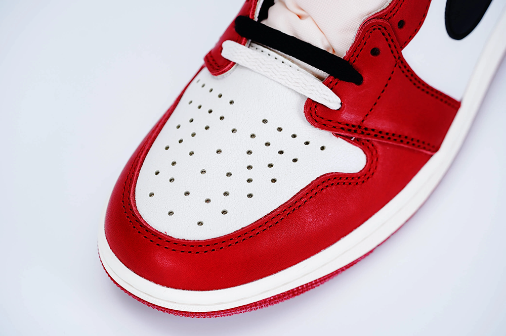 A top view of the toebox on the Jordan 1 Chicago High OG ‘Lost & Found,’ highlighting its red leather material