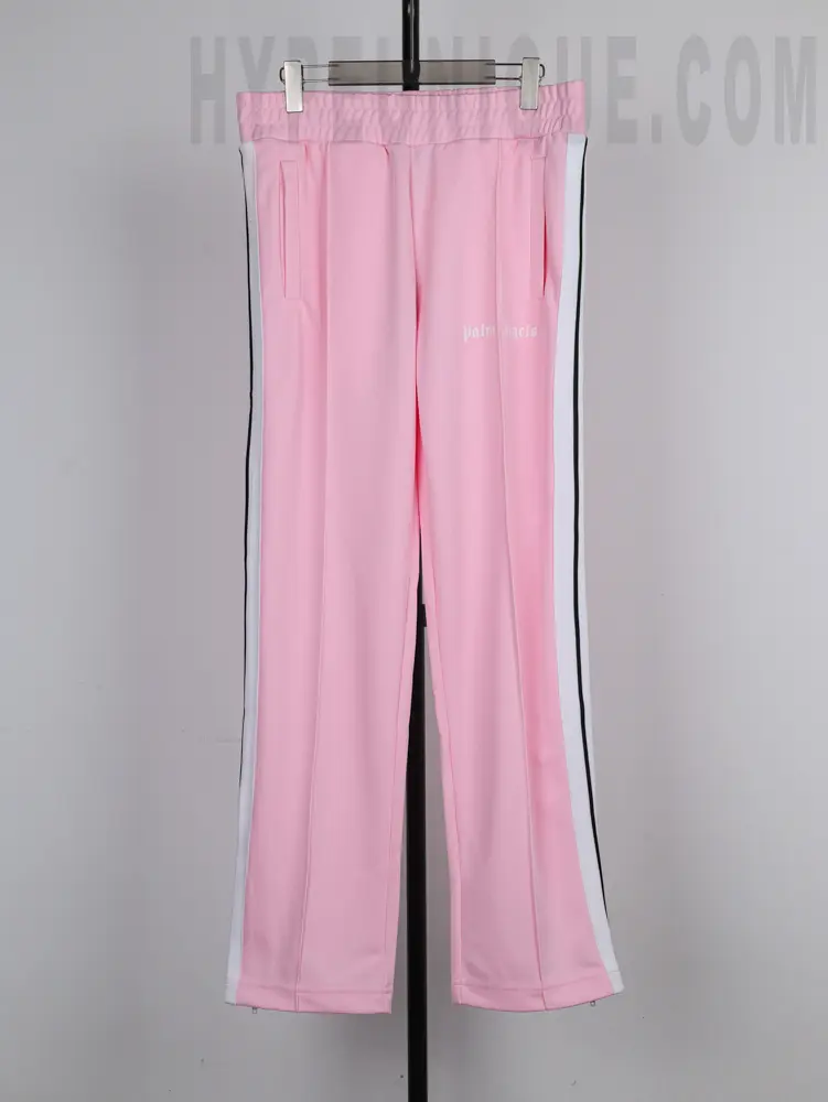 a blue pants with white stripes on a rack