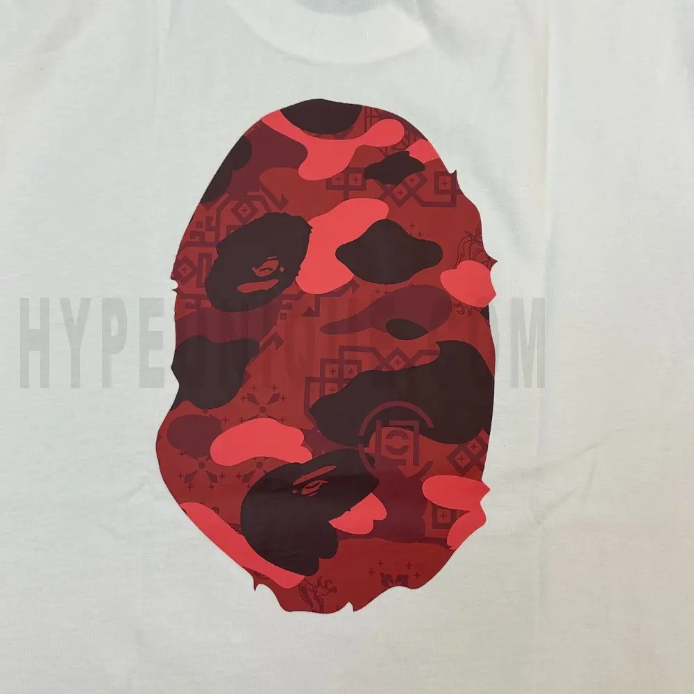 Detailed shot capturing the graphic print on the white tee's back panel.