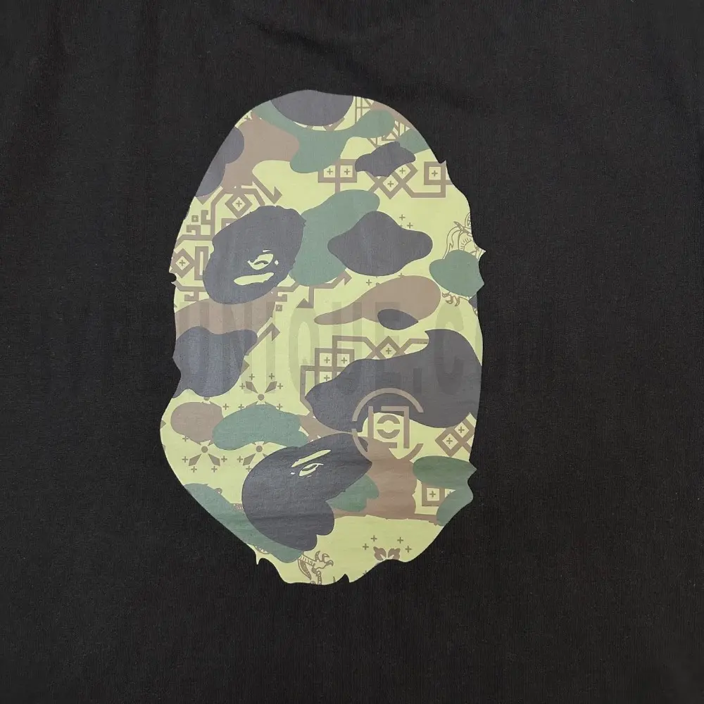 Detailed shot capturing the graphic print on the black tee's back panel.