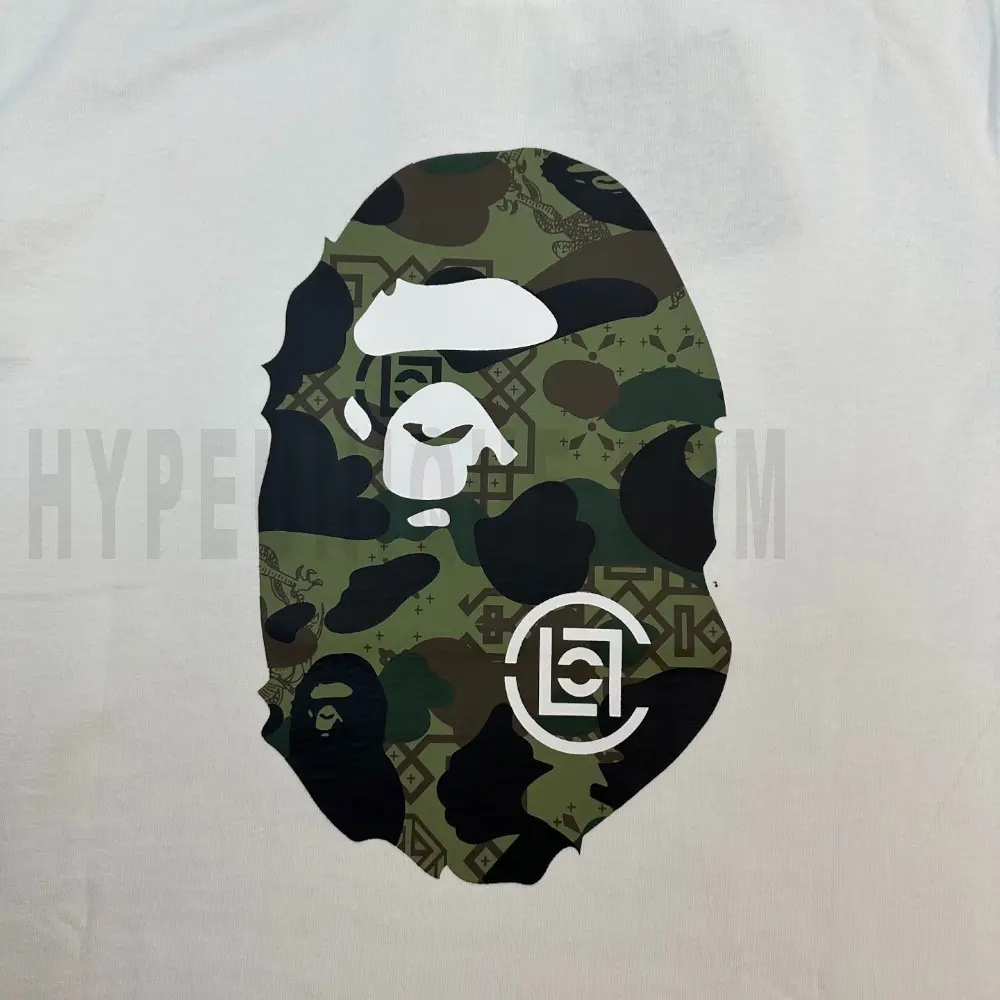 Detailed shot capturing the graphic print on the white tee's front panel.