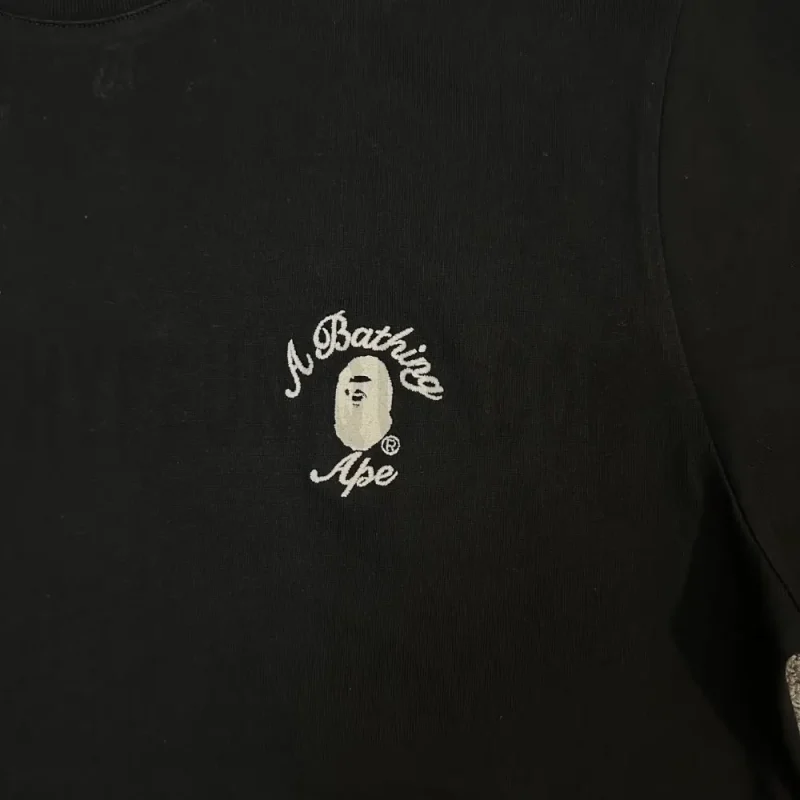 Close-up of the T-shirt print details of the front of the black clothes.