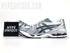 Front view of the ASICS Gel-Kayano 14 “Monaco Blue” alongside the Hypeunique brand logo.