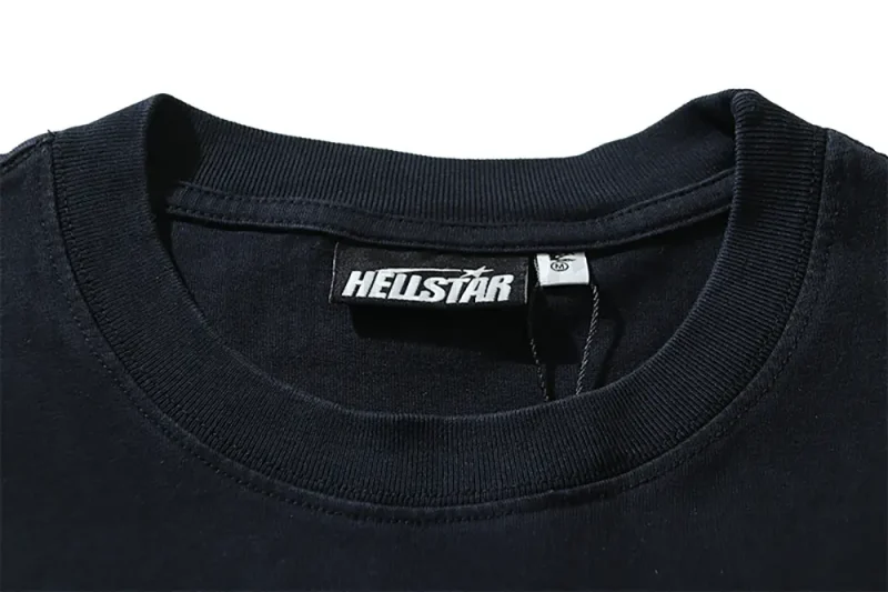 Close-up of the T-shirt's neckline tag, showcasing wash care instructions and brand details in a fashion design.