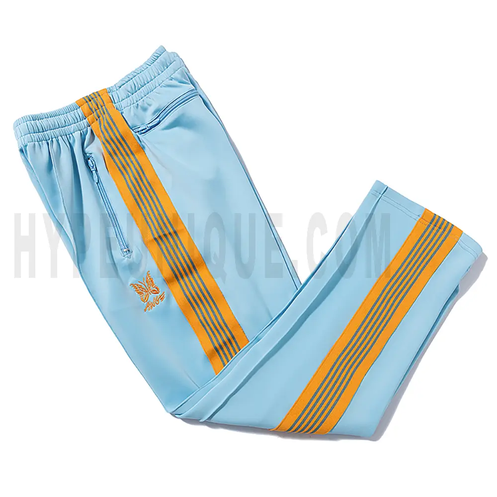 Side view of blue track pants.