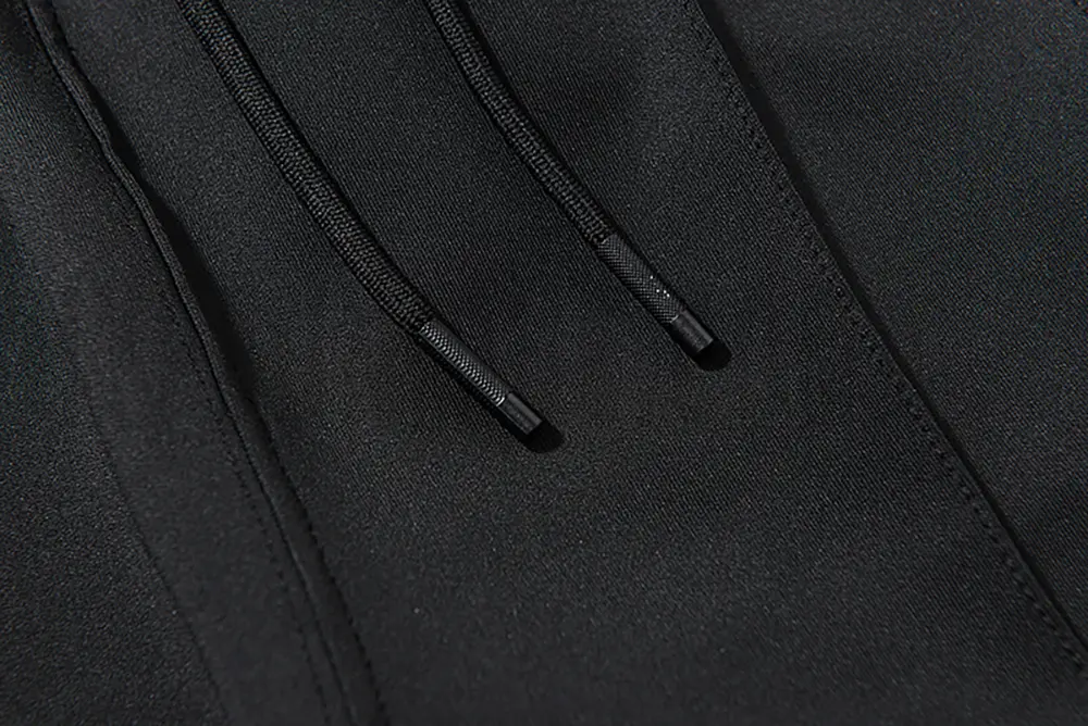 Adjustable webbing belt at the waist for a customizable fit.
