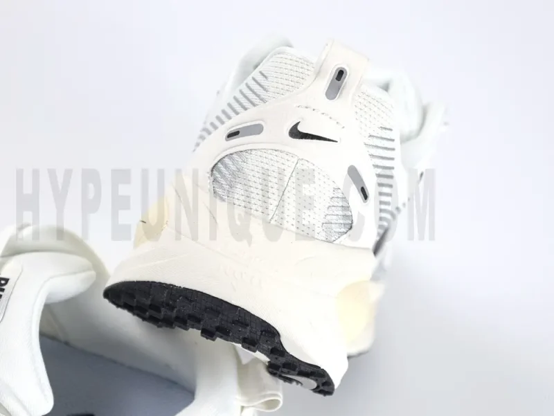 The white heel of Nike Vomero 18 Summit White Coconut Milk