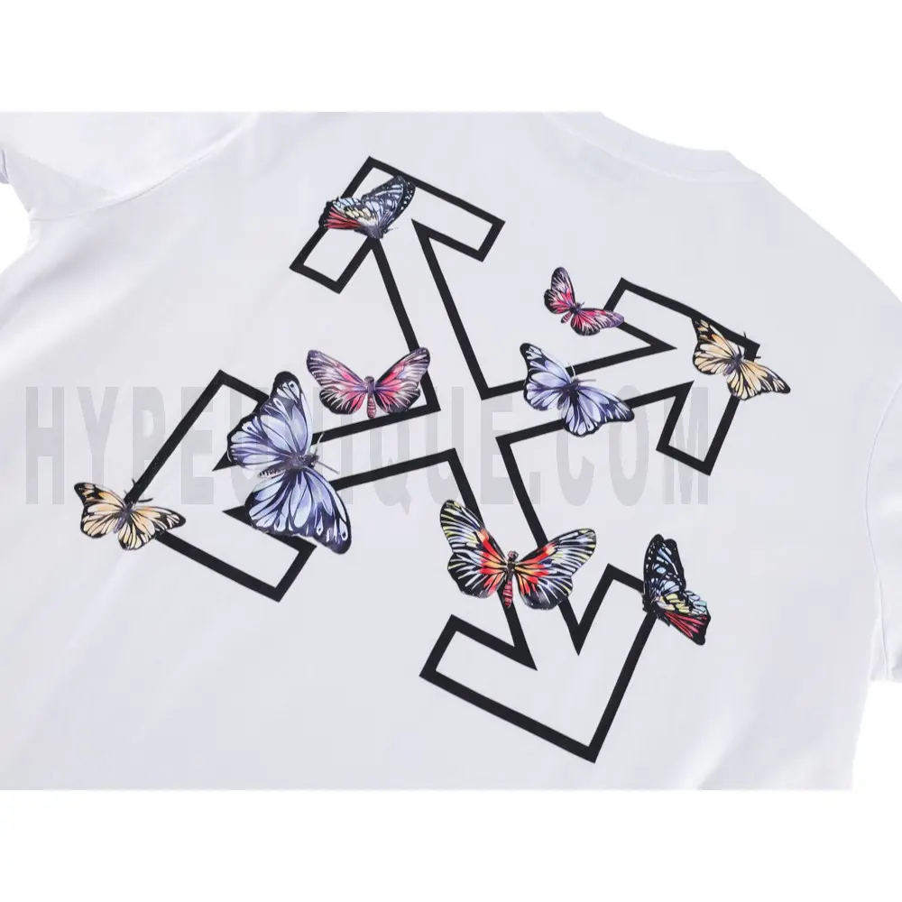 Detailed shot capturing the graphic print on the white tee's back panel.