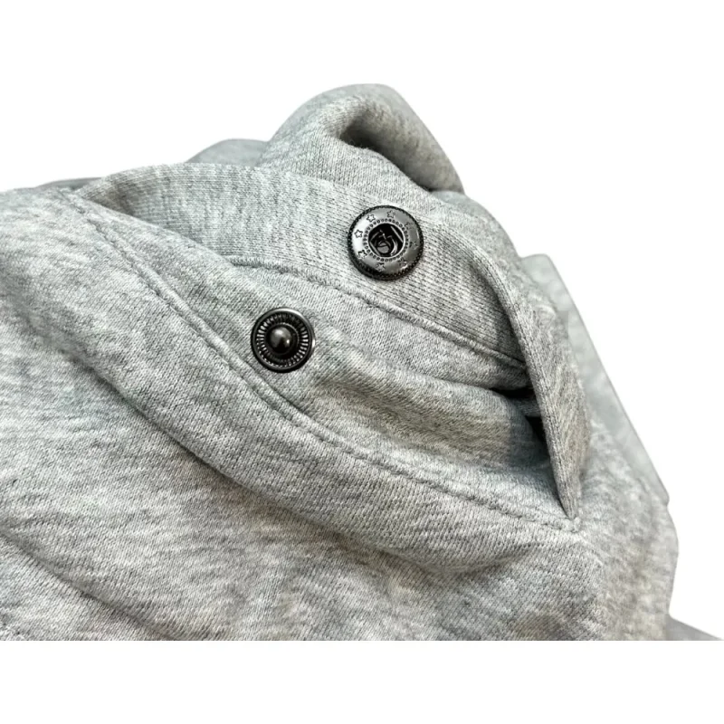 Close-up of button detail on the shorts.