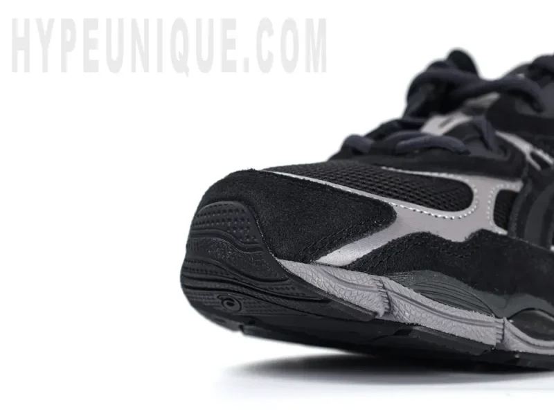 Black and grey athletic running shoe