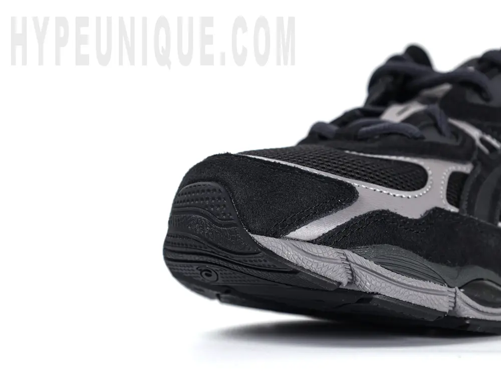 Black and grey athletic running shoe