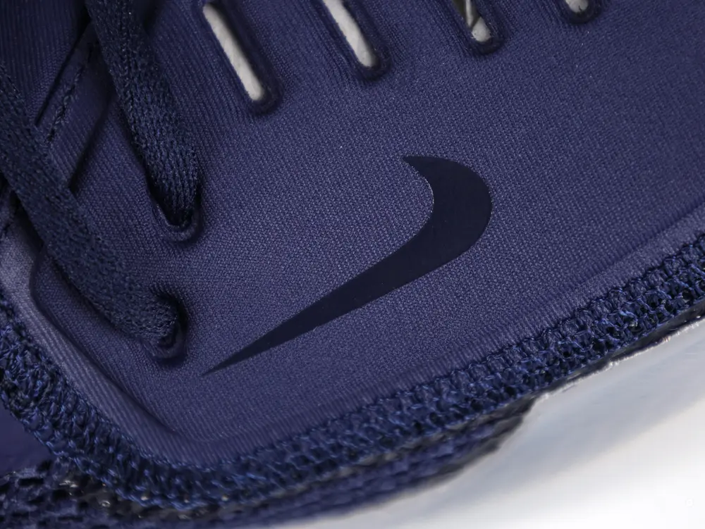 the dark blue swoosh