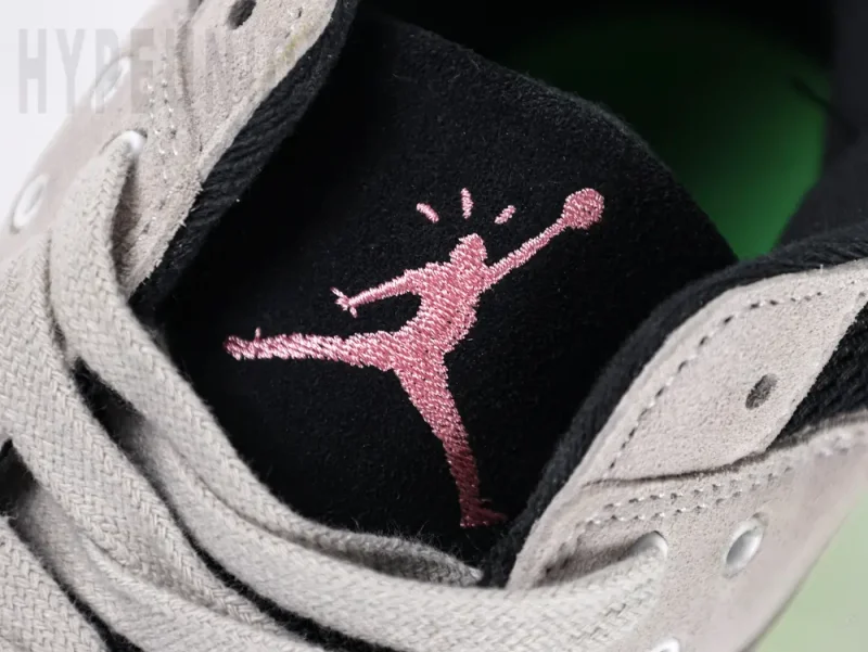 the pink jordan logo on the tongue