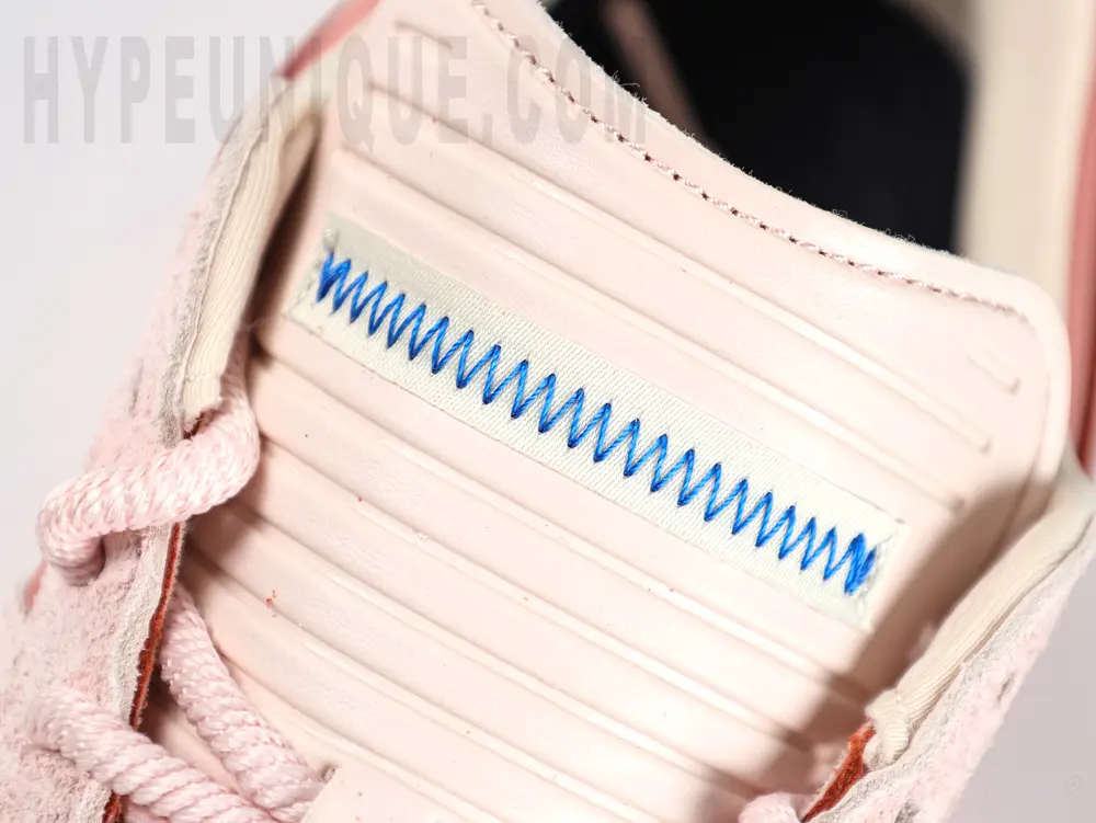 a close up of a pink shoe