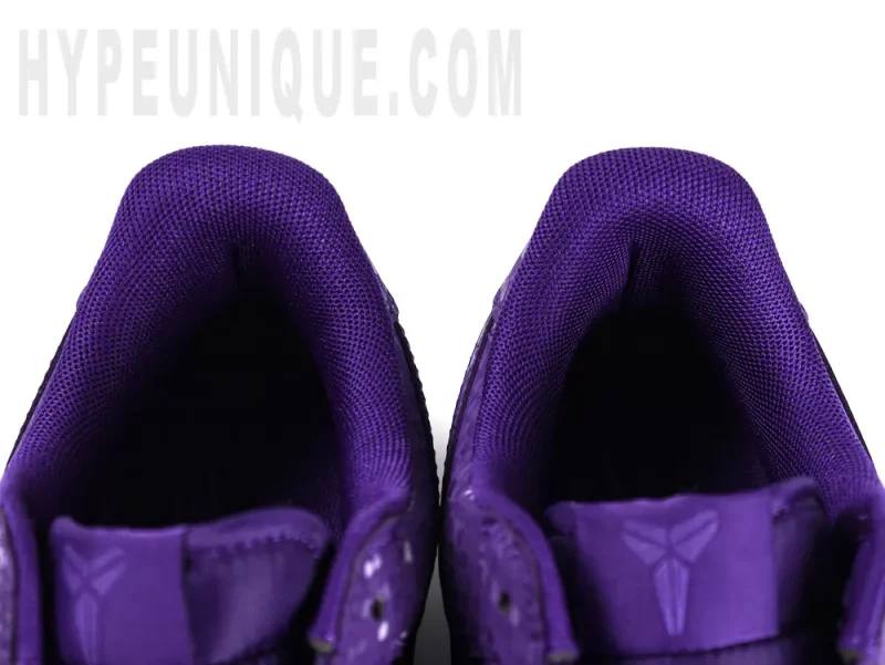 Purple Nike insoles on white background