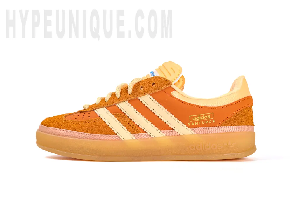 The Bad Bunny x Gazelle Indoor 'Santurce' front view of the left foot. Showing the orange and suede material.