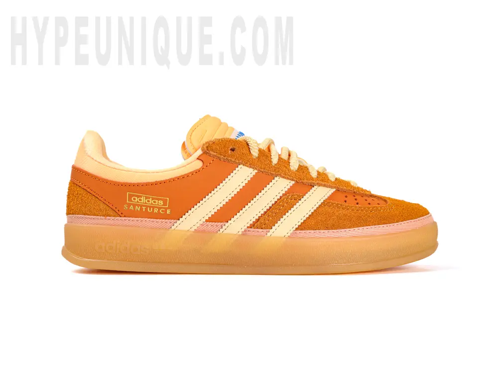 The Bad Bunny x Gazelle Indoor 'Santurce' is seen from the left foot. Showing the orange design.