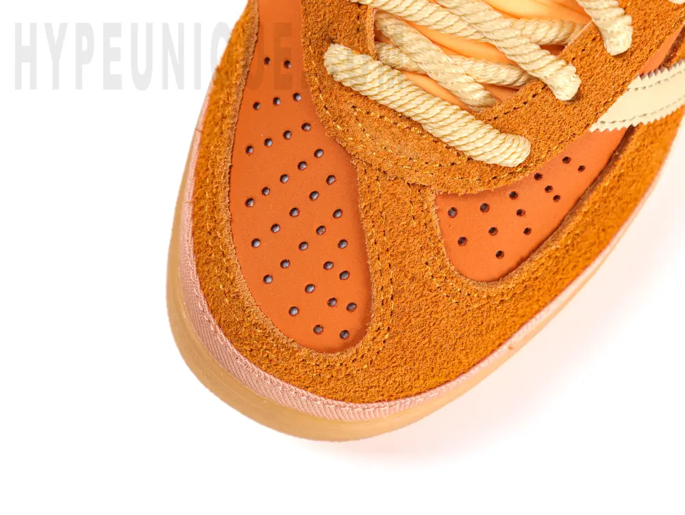 A top view of the Bad Bunny x Gazelle Indoor 'Santurce' shoe. Orange suede toe cap