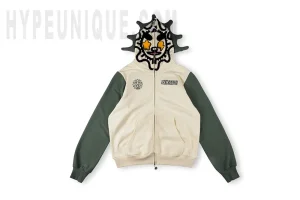 Front view of the Glomerica Full Zip Hoodie (Cream/Sage). Showing the unique hood and overall beige and green colorway.
