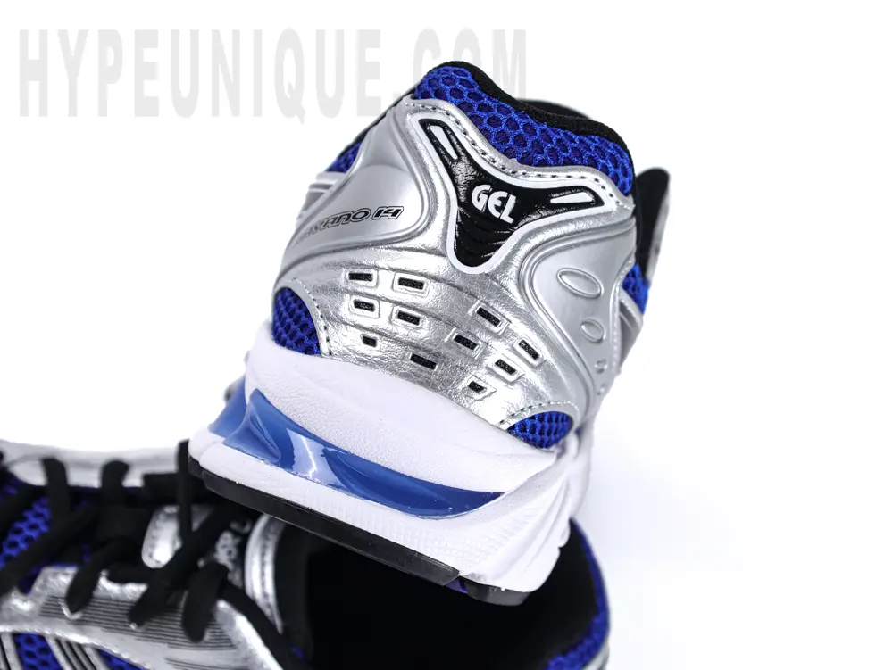 Rear view of the ASICS Gel-Kayano 14 “Monaco Blue”, featuring silver leather material on the heel.