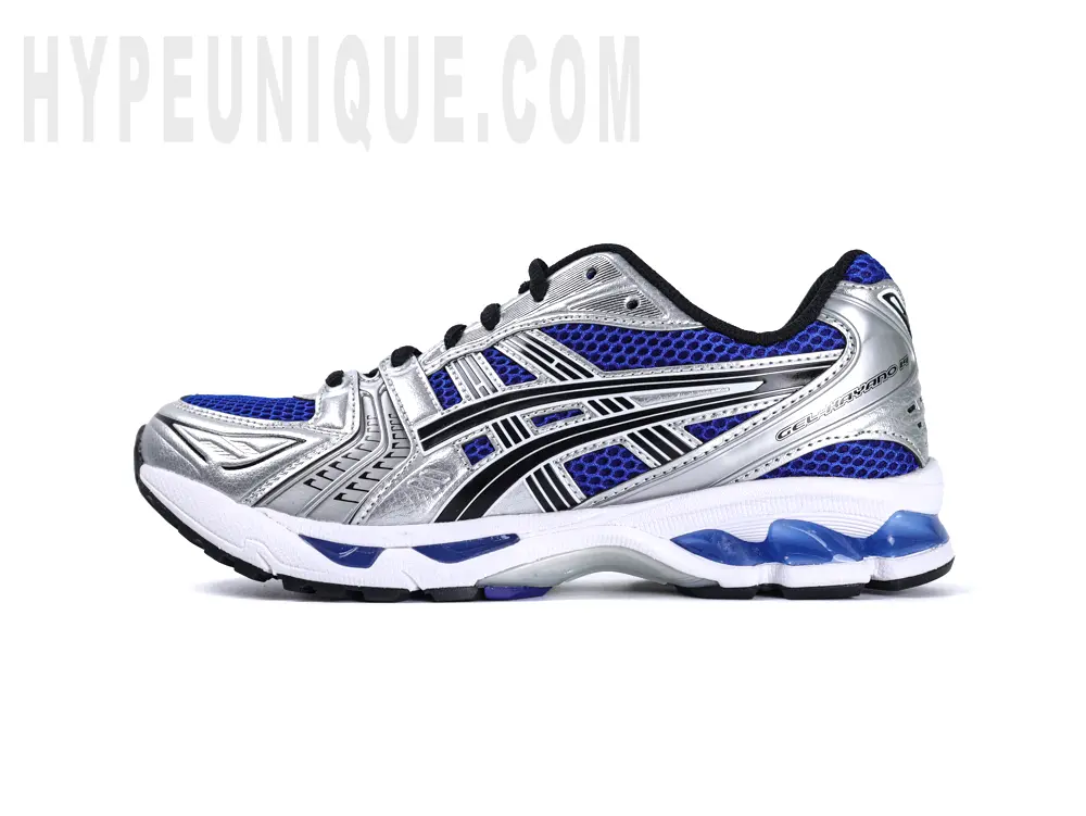 Left-side view of the ASICS Gel-Kayano 14 “Monaco Blue”, showcasing its layered black, silver, and blue upper materials paired with a clean white rubber outsole.