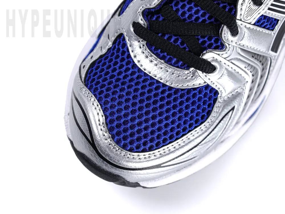 Close-up view of the ASICS Gel-Kayano 14 “Monaco Blue” toe area, featuring a blue breathable mesh toe box and a silver mudguard.