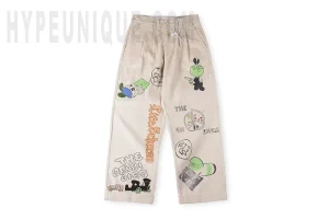 Front view of the KAPITAL Ivy Wide-Leg Pleated Printed Cotton-Corduroy Trousers.