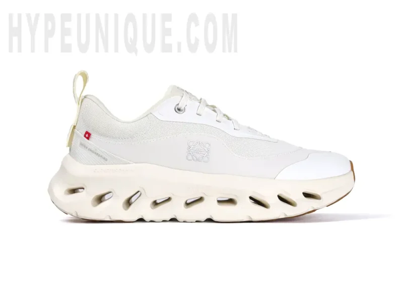 Front view of the right shoe inner side of the On Cloudtilt Loewe 2 ‘All White’, showcasing the all-white design and breathable mesh material.