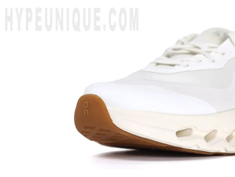 Front-right view of the On Cloudtilt Loewe 2 ‘All White’ toe area, showcasing the pure white eco-friendly material.