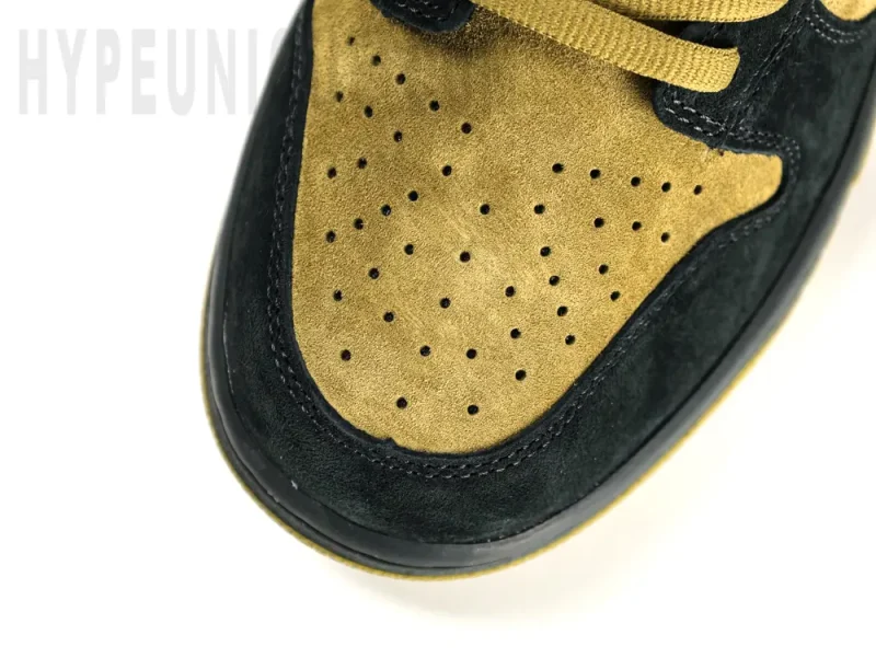 A rear-right view of the shoe's heel. Showing the black, green, and light green suede heel.