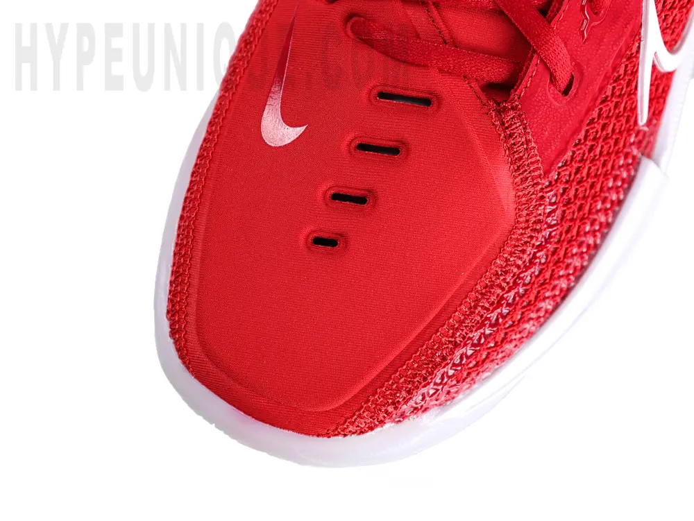 Top-down close-up view of the Zoom GT Cut TB ‘University Red’ toe area, showcasing a dual-material design with red woven mesh and cotton fabric.
