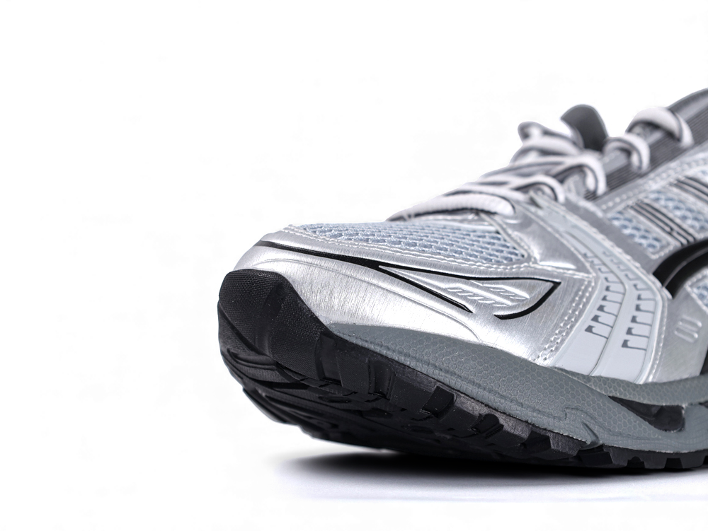 Silver and black athletic running shoe