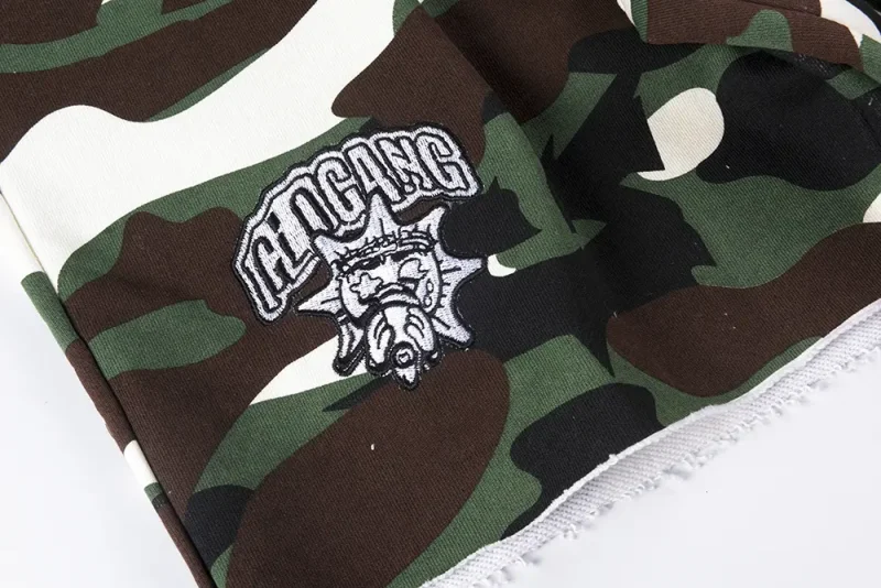 Brand logo on the right side of the pant leg