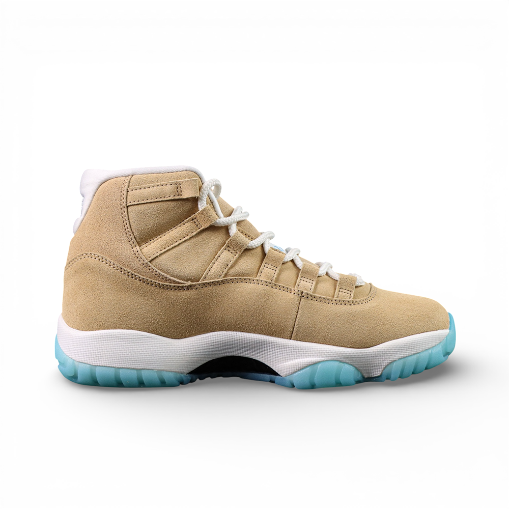 Beige suede high-top sneaker with white laces and light blue sole.