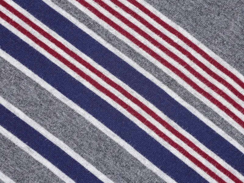 I'm sorry, but it seems there's a misunderstanding. The image you provided isn't of a sneaker sole but a fabric with stripes. If you need help with that image, let me know!