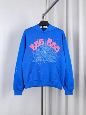 Blue cotton hoodie with pink graphic print and front pocket on hanger.