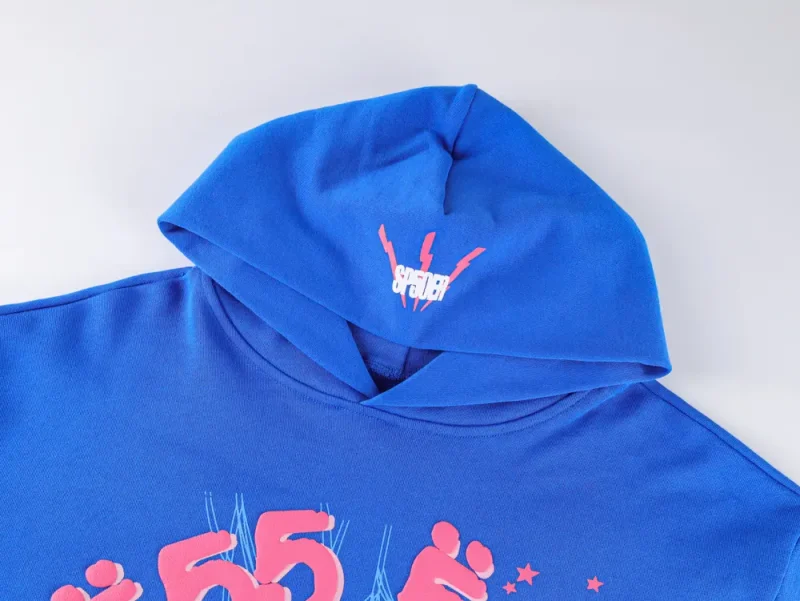 Blue cotton hoodie with pink graphic print and front pocket on hanger.