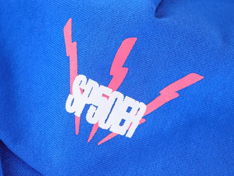 Blue fabric with red lightning bolt design and "SP5DER" text overlay.