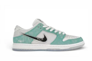 A side view of a sneaker with turquoise suede overlays, white perforated leather, a mesh upper, and shiny black swoosh.