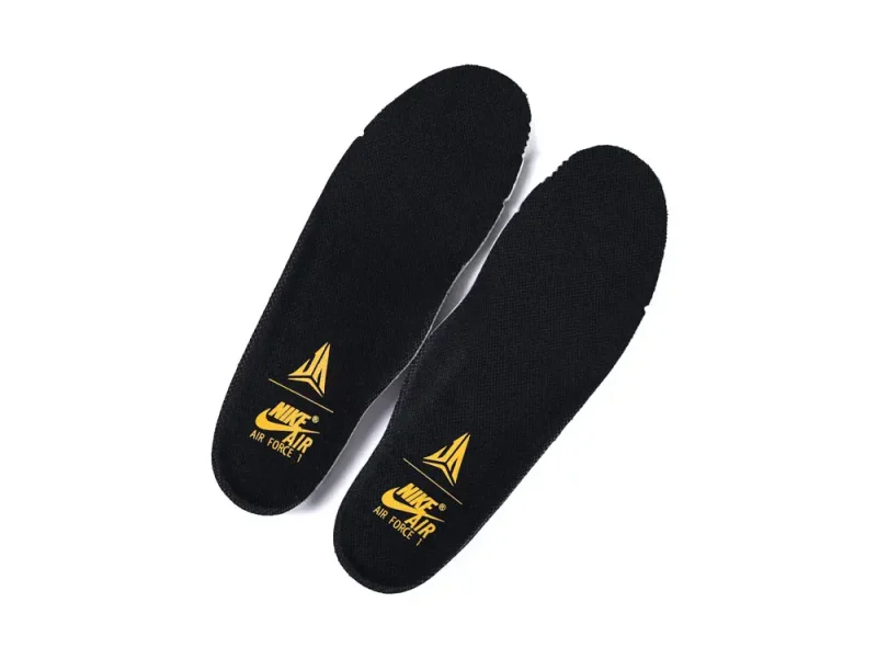 Black fabric insoles with yellow branding, designed for comfort and support.