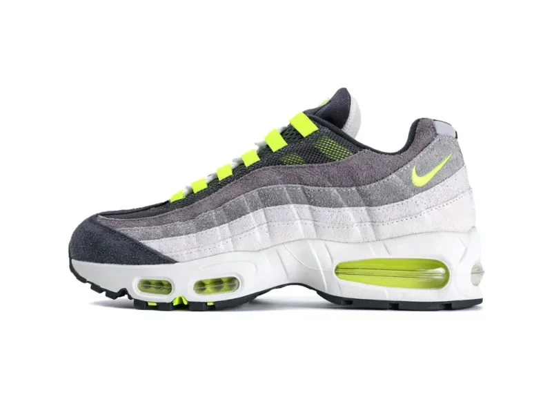Gray and neon green sneaker with mesh upper and cushioned sole.