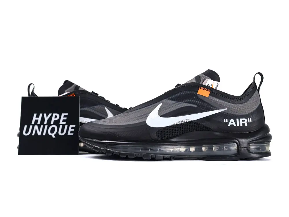 Black mesh sneakers with white logo, transparent sole, and orange accents.