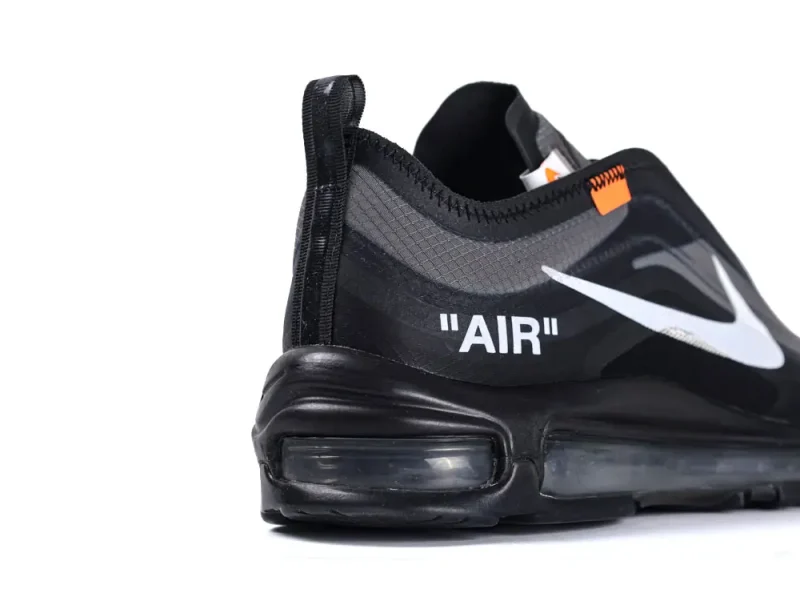 Black sneaker with a mesh upper, visible air unit, and white branding detail.