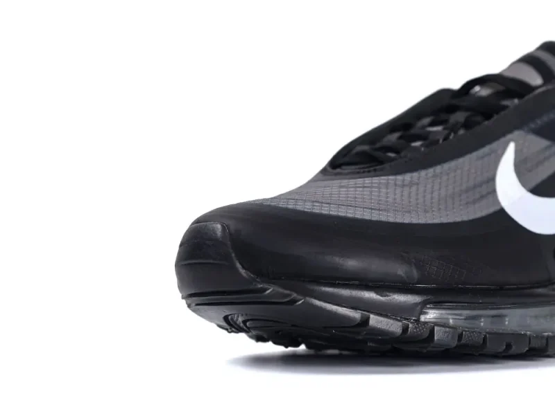 Black and gray sneaker with mesh material and visible air cushion insole.