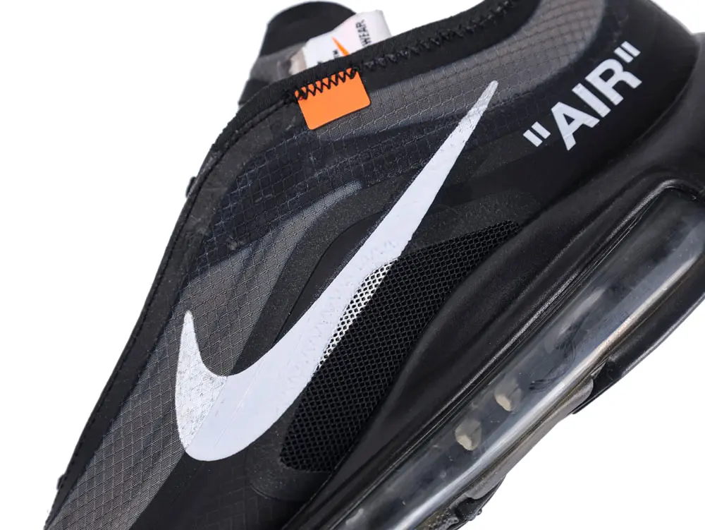 Black and gray sneaker with white swoosh logo and visible air sole unit.